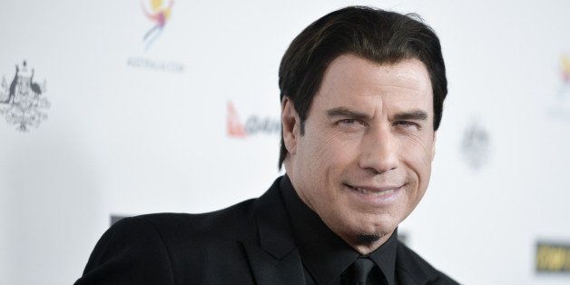 John Travolta arrives at the 2014 G'Day USA Los Angeles Black Tie Gala on Saturday, Jan. 11, 2014 in Los Angeles. (Photo by Richard Shotwell/Invision/AP)