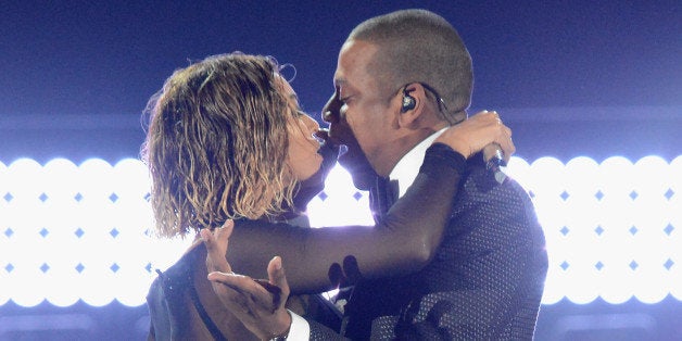 LOS ANGELES, CA - JANUARY 26: Singer Beyonce (L) and rapper Jay-Z onstage during the 56th GRAMMY Awards at Staples Center o