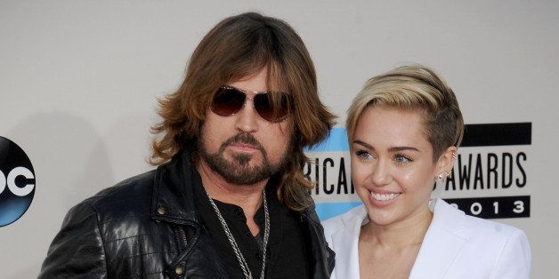 LOS ANGELES, CA - NOVEMBER 24: Miley Cyrus and Billy Ray Cyrus arrive at the 2013 American Music Awards at Nokia Theatre L.A. Live on November 24, 2013 in Los Angeles, California. (Photo by Gregg DeGuire/WireImage)