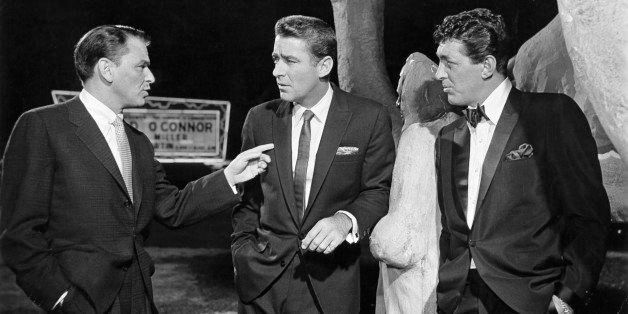 Frank Sinatra points to Peter Lawford and Dean Martin in a scene from the film 'Ocean's Eleven', 1960. (Photo by Warner Brothers/Getty Images)