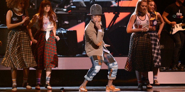 LONDON, ENGLAND - FEBRUARY 19: Pharrell Williams performs at The BRIT Awards 2014 at 02 Arena on February 19, 2014 in London, England. (Photo by Karwai Tang/WireImage)