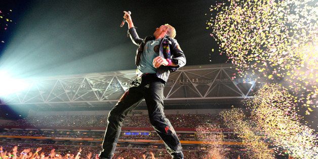 BRISBANE, AUSTRALIA - NOVEMBER 21: Chris Martin of Coldplay performs live for fans at Suncorp Stadium on November 21, 2012 in Brisbane, Australia. (Photo by Bradley Kanaris/Getty Images)