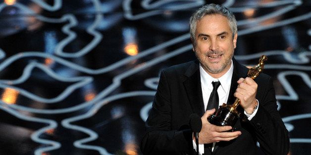 HOLLYWOOD, CA - MARCH 02: Director Alfonso Cuaron accepts the Best Achievement in Directing award for 'Gravity' onstage during the Oscars at the Dolby Theatre on March 2, 2014 in Hollywood, California. (Photo by Kevin Winter/Getty Images)
