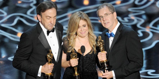 HOLLYWOOD, CA - MARCH 02: (L-R) Producer Peter Del Vecho, directors Jennifer Lee and Chris Buck accept the Best Animated Feature Film award for 'Frozen' onstage during the Oscars at the Dolby Theatre on March 2, 2014 in Hollywood, California. (Photo by Kevin Winter/Getty Images)