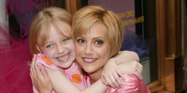 NEW YORK - AUGUST 7: Actors Brittany Murphy (R) and Dakota Fanning help unveil the 'Uptown Girls' window display at Henri Be