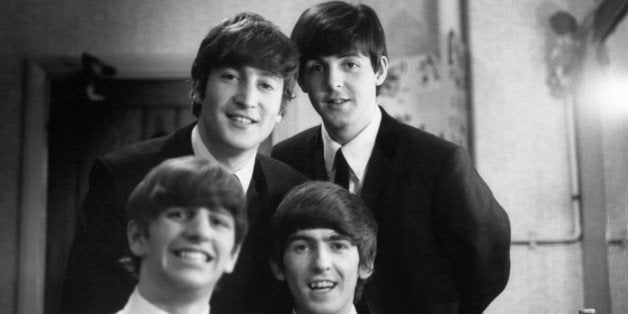 LONDON - 30th DECEMBER: The Beatles posed backstage at the Finsbury Park Astoria, London during the band's Christmas Show residency on 30th December 1963. Clockwise from top left: John Lennon (1940-1980), Paul McCartney, George Harrison (1943-2001) and Ringo Starr. (Photo by Val Wilmer/Redferns)