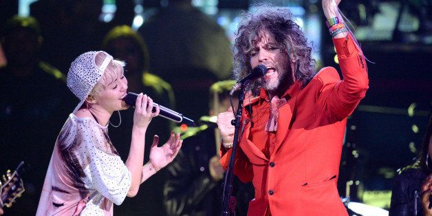 LOS ANGELES, CA - FEBRUARY 22: Miley Cyrus and Wayne Coyne perform at Staples Center on February 22, 2014 in Los Angeles, California. (Photo by Jeff Kravitz/FilmMagic)