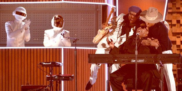 LOS ANGELES, CA - JANUARY 26: (L-R) Musicians Daft Punk; Nile Rodgers, Stevie Wonder and Pharrell Williams perform onstage during the 56th GRAMMY Awards at Staples Center on January 26, 2014 in Los Angeles, California. (Photo by Kevin Winter/WireImage)