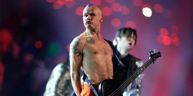 EAST RUTHERFORD, NJ - FEBRUARY 02: Flea of the Red Hot Chili Peppers performs during the Pepsi Super Bowl XLVIII Halftime Show at MetLife Stadium on February 2, 2014 in East Rutherford, New Jersey. (Photo by Rob Carr/Getty Images)