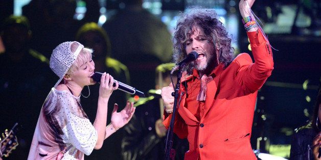 LOS ANGELES, CA - FEBRUARY 22: Miley Cyrus and Wayne Coyne perform at Staples Center on February 22, 2014 in Los Angeles, California. (Photo by Jeff Kravitz/FilmMagic)