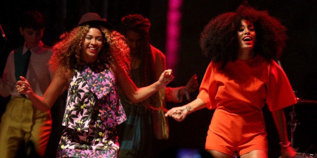 INDIO, CA - APRIL 12: Singer Beyonce (L) performs with her sister Solange Knowles onstage during day 2 of the 2014 Coachella Valley Music & Arts Festival at the Empire Polo Club on April 12, 2014 in Indio, California. (Photo by Imeh Akpanudosen/Getty Images for Coachella)