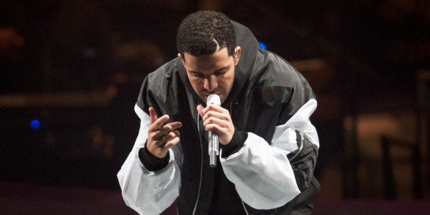 LONDON, UNITED KINGDOM - MARCH 24: Drake performs on stage at O2 Arena on March 24, 2014 in London, United Kingdom. (Photo by Joseph Okpako/Redferns via Getty Images)