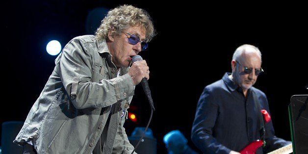 Roger Daltrey (L) and Pete Townshend, singer and guitarist of the British band The Who perform on the stage of the Ziggodome in Amsterdam, on July 5, 2013. AFO PHOTO/ANP PAUL BERGEN (Photo credit should read PAUL BERGEN/AFP/Getty Images)