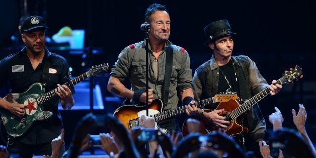 Bruce Springsteen, center, and members of the E Street Band perform at Time Warner Cable Arena in Charlotte, N.C., on Saturda