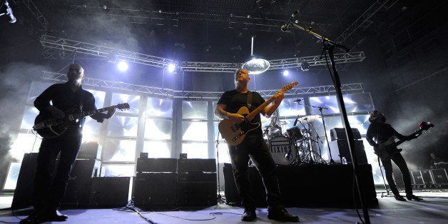 LAS VEGAS, NV - FEBRUARY 23: (L-R) Guitarist Joey Santiago and singer/guitarist Black Francis of the band Pixies perform with bassist Paz Lenchantin at The Joint inside the Hard Rock Hotel & Casino on February 23, 2014 in Las Vegas, Nevada. (Photo by Ethan Miller/Getty Images)