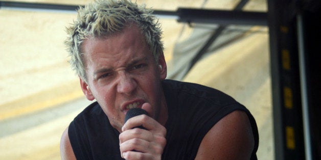 ORLANDO, FL - JULY 24: Lead singer of Simple Plan rocks out at the Vans Warped tour at the Central Florida Fair Grounds on July 24, 2003 in Orlando, Florida. (Photo by Kellie Warren/Getty Images)