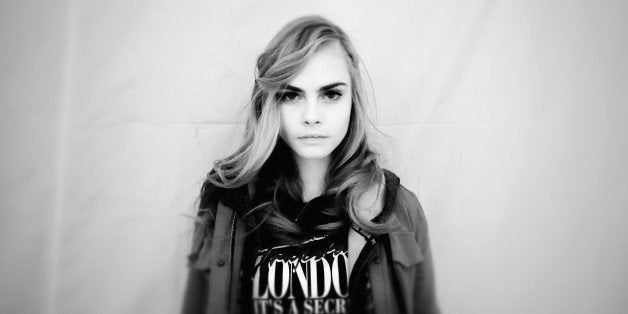 PARIS, FRANCE - FEBRUARY 27: (Editors Note: This image was processed using digital filters) Model Cara Delevingne poses backstage before the H&M Fall/Winter 2013 Ready-to-Wear show as part of Paris Fashion Week on February 27, 2013 in Paris, France. (Photo by Gareth Cattermole/Getty Images)