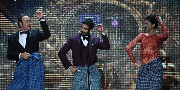 (From L-R) US actor Kevin Spacey, Bollywood actor Shahdid Kapoor (C) and Bollywood actress Deepika Padukone perform on stage