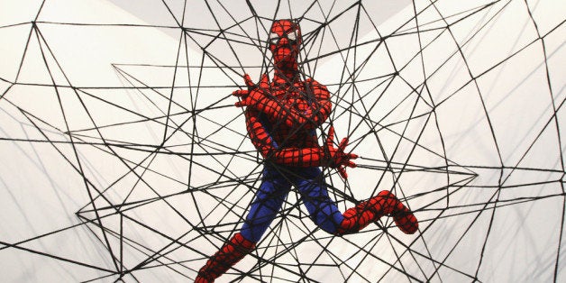 BERLIN, GERMANY - APRIL 26: The knitted sculpture 'Spiderman' by Patricia Waller, featuring the comic book character as an imprisoned victim of his own web, hangs in the 'Broken Heroes' exhibition at the Deschler Gallery on April 26, 2012 in Berlin, Germany. The exhibition of hand-crocheted comic, puppet and cartoon figures shows icons of pop culture in various unfortunate states. (Photo by Adam Berry/Getty Images)