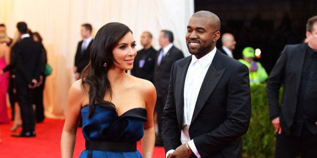 NEW YORK, NY - MAY 05: Kim Kardashian (L) and Kanye West attend the 'Charles James: Beyond Fashion' Costume Institute Gala at the Metropolitan Museum of Art on May 5, 2014 in New York City. (Photo by Mike Coppola/Getty Images)