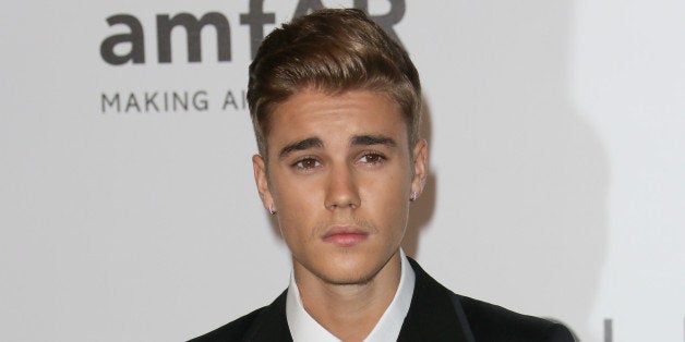 CAP D'ANTIBES, FRANCE - MAY 22: Justin Bieber attends amfAR's 21st Cinema Against AIDS Gala, Presented By WORLDVIEW, BOLD FILMS, And BVLGARI at the 67th Annual Cannes Film Festival on May 22, 2014 in Cap d'Antibes, France. (Photo by Tony Barson/FilmMagic)