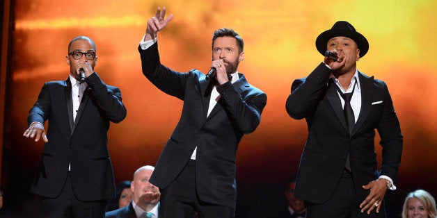 NEW YORK, NY - JUNE 08: T.I., Hugh Jackman and LL Cool J performs onstage during the 68th Annual Tony Awards at Radio City Music Hall on June 8, 2014 in New York City. (Photo by Theo Wargo/Getty Images for Tony Awards Productions)