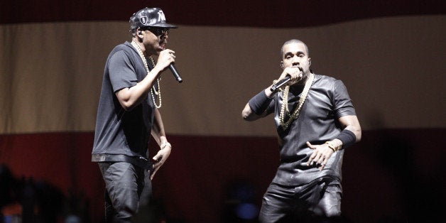 US rappers Kanye West and Jay-Z (L) perform during a concert as part of their tour 'Watch the Throne' on June 1, 2012 in Paris Bercy. AFP PHOTO GUILLAUME BAPTISTE / RESTRICTED TO EDITORIAL (Photo credit should read GUILLAUME BAPTISTE/AFP/GettyImages)