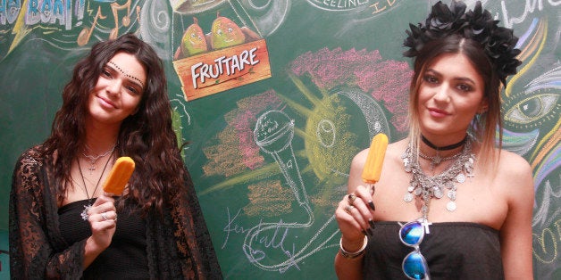 INDIO, CA - APRIL 12: Kendall and Kylie Jenner visit the Fruttare Hangout at Coachella to refresh in between sets with a Fru