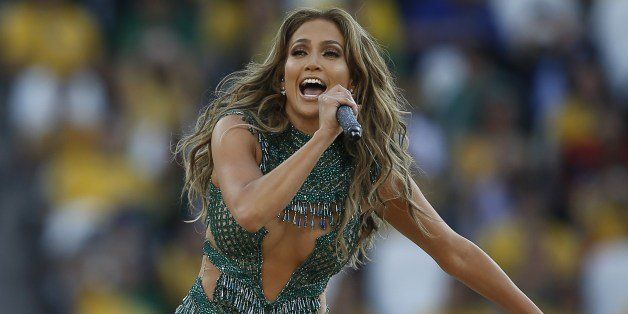 US singer Jennifer Lopez performs during the opening ceremony of the 2014 FIFA World Cup at the Corinthians Arena in Sao Paulo prior to the opening Group A football match between Brazil and Croatia on June 12, 2014. AFP PHOTO / ADRIAN DENNIS (Photo credit should read ADRIAN DENNIS/AFP/Getty Images)