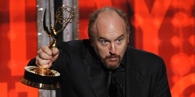 LOS ANGELES, CA - SEPTEMBER 23: Actor/writer Louis CK accepts Outstanding Writing for a Comedy Series award for 'Louie' onstage during the 64th Annual Primetime Emmy Awards at Nokia Theatre L.A. Live on September 23, 2012 in Los Angeles, California. (Photo by Kevin Winter/Getty Images)