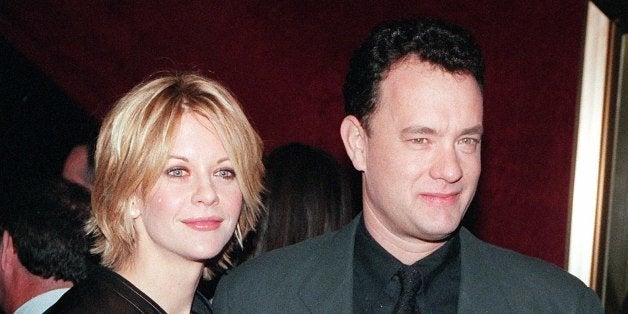 NEW YORK, UNITED STATES: Meg Ryan and Tom Hanks pose for photographers at the premiere of 'You've Got Mail,' at the Ziegfeld Theatre 10 December in New York City. In the movie, Hanks and Ryan play enemies who meet anonymously in cyberspace and fall in love. AFP PHOTO/Matt CAMPBELL (Photo credit should read MATT CAMPBELL/AFP/Getty Images)