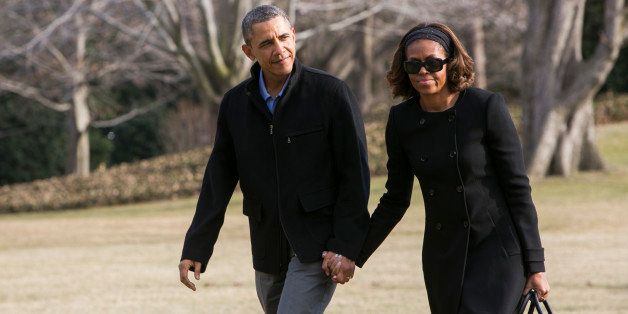 WASHINGTON, DC - MARCH 9: U.S. President Barack Obama (L) and the first lady Michelle Obama return to the White House on March 9, 2014 in Washington, DC. Obama was in Florida for a vacation after an official event in Miami. (Photo by Kristoffer Tripplaar-Pool/Getty Images)