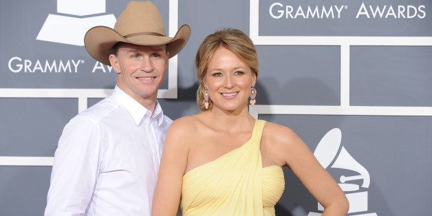 Singer Jewel arrives with Ty Murray for the 53rd annual Grammy Awards at the Staples Center in Los Angeles on February 13, 2011. AFP PHOTO / Robyn Beck (Photo credit should read ROBYN BECK/AFP/Getty Images)