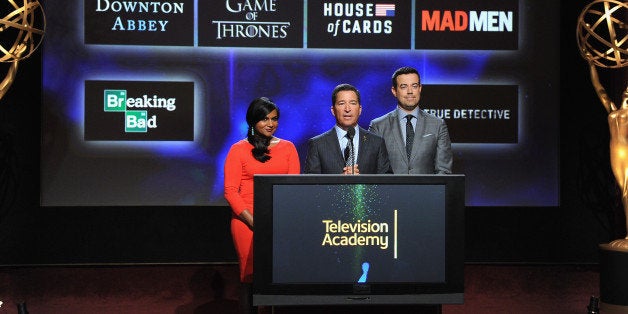 NORTH HOLLYWOOD, CA - JULY 10: Actress Mindy Kaling, Television Academy Chairman & CEO Bruce Rosenblum and tv personality Carson Daly speak onstage at the 66th Primetime Emmy Awards Nominations at Leonard H. Goldenson Theatre on July 10, 2014 in North Hollywood, California. (Photo by Kevin Winter/Getty Images)