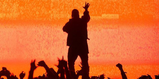 MANCHESTER, TN - JUNE 13: Artist Kanye West performs at the Bonnaroo Music & Arts Festival on June 13, 2014 in Manchester, Tennessee. (Photo by Jason Merritt/Getty Images)