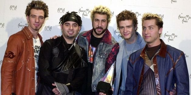 LOS ANGELES, UNITED STATES: (L to R) J.C. Chasez, Chris Kirkpatrick, Joey Fatone, Justin Timberlake, Lance Bass of the group 'N Sync, pose with their award for Internet Artist of the Year at the 28th Annual American Music Awards 08 January 2001 in Los Angeles, CA. AFP PHOTO/Lucy NICHOLSON (Photo credit should read LUCY NICHOLSON/AFP/Getty Images)