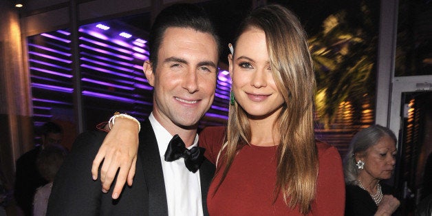 WEST HOLLYWOOD, CA - MARCH 02: (EXCLUSIVE ACCESS, SPECIAL RATES APPLY) Behati Prinsloo and Adam Levine attend the 2014 Vanity Fair Oscar Party Hosted By Graydon Carter on March 2, 2014 in West Hollywood, California. (Photo by Kevin Mazur/VF14/WireImage)