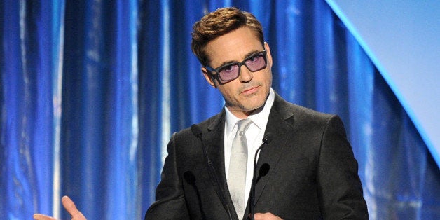 BEVERLY HILLS, CA - JANUARY 19: Actor Robert Downey Jr. speaks onstage during the 25th annual Producers Guild of America Awards at The Beverly Hilton Hotel on January 19, 2014 in Beverly Hills, California. (Photo by Kevin Winter/Getty Images)