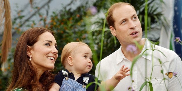 A photograph taken in London on Wednesday July 2, 2014, to mark Britain's Prince George's first birthday, shows Prince William (R) and Catherine, Duchess of Cambridge (L) with Prince George during a visit to the Sensational Butterflies exhibition at the Natural History Museum in London. Britain's Prince William and his wife Catherine on Monday thanked well-wishers around the world as they prepared to celebrate their son Prince George's first birthday. AFP PHOTO/John Stillwell/POOLEDITORIAL USE ONLY (Photo credit should read JOHN STILLWELL/AFP/Getty Images)