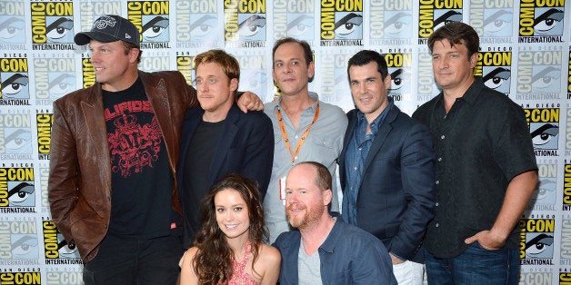 SAN DIEGO, CA - JULY 13: The Cast of Firefly (Standing L-R) Adam Baldwin, Alan Tudyk Tim Minear. Sean Maher, Nathan Fillion, (Kneeling) Summer Glau and Joss Whedon at the 'Firefly' 10 Year Anniversary Reunion Press Conference during Comic-Con International 2012 held at the Hilton San Diego Bayfront Hotel on July 13, 2012 in San Diego, California. (Photo by Frazer Harrison/Getty Images)