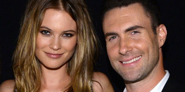 LOS ANGELES, CA - JANUARY 27: (L-R) Model Behati Prinsloo and recording artist Adam Levine of Maroon 5 attend 'The Night That Changed America: A GRAMMY Salute To The Beatles' at the Los Angeles Convention Center on January 27, 2014 in Los Angeles, California. (Photo by Larry Busacca/Getty Images for NARAS)