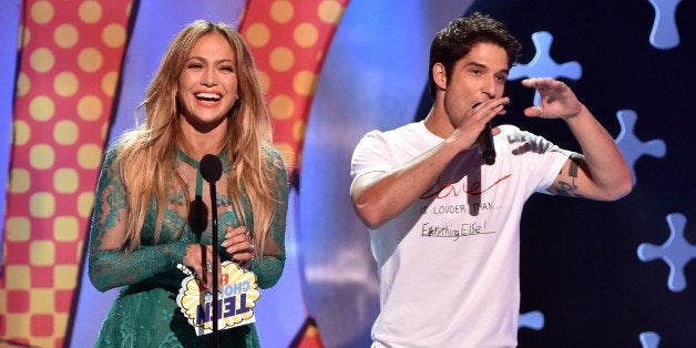 LOS ANGELES, CA - AUGUST 10: Recording artist Jennifer Lopez (L) and actor Tyler Posey onstage during FOX's 2014 Teen Choice