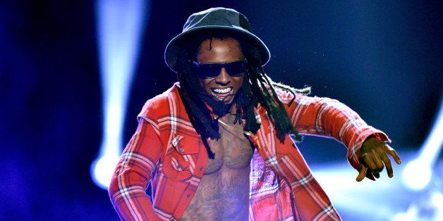 LOS ANGELES, CA - JUNE 29: Rapper Lil Wayne performs onstage during the BET AWARDS '14 at Nokia Theatre L.A. LIVE on June 29, 2014 in Los Angeles, California. (Photo by Kevin Winter/Getty Images for BET)