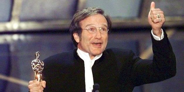 LOS ANGELES, UNITED STATES: Actor Robin Williams holds up his Oscar after winning in the Best Actor in a Supporting Role category during the 70th Academy Awards 23 March at the Shrine Auditorium in Los Angeles. Williams won for his role as a psychotherapist helping a troubled math genius in 'Good Will Hunting.' (ELECTRONIC IMAGE) AFP PHOTO Timothy A. CLARY (Photo credit should read TIMOTHY A. CLARY/AFP/Getty Images)