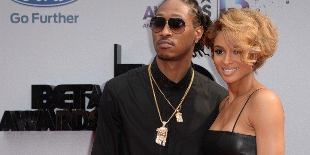 Ciara (R) and Future arrive for the 2013 BET Awards at the Nokia Theatre L.A. Live in Los Angeles, California June 30, 2013. The awards ceremony recognize Americans in music, movies, sports and other fields of entertainment over the past year. AFP PHOTO / ROBYN BECK (Photo credit should read ROBYN BECK/AFP/Getty Images)