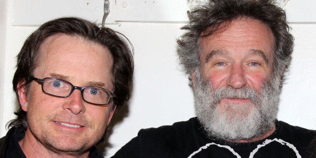 NEW YORK, NY - APRIL 09: Michael J. Fox and Robin Williams pose backstage at the hit play 'Bengal Tiger at the Baghdad Zoo'