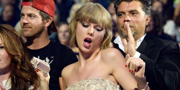 NASHVILLE, TN - JUNE 05: Musician Taylor Swift dances in the audience during the 2013 CMT Music Awards at the Bridgestone Arena on June 5, 2013 in Nashville, Tennessee. (Photo by Jeff Kravitz/FilmMagic)