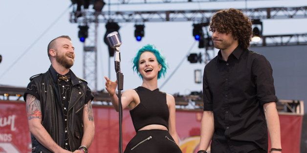 CLEVELAND, OH - JULY 21: Jeremy Davis, Hayley Williams and Taylor York of Paramore attend the Alternative Press Music Awards at Rock and Roll Hall of Fame and Museum on July 21, 2014 in Cleveland, United States. (Photo by Daniel Boczarski/Redferns via Getty Images)