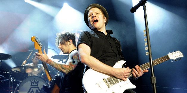 CONCORD, CA - AUGUST 17: Joe Trohman (L) and Patrick Stump of Fall Out Boy perform at Concord Pavilion on August 17, 2014 in Concord, California. (Photo by Tim Mosenfelder/Getty Images)