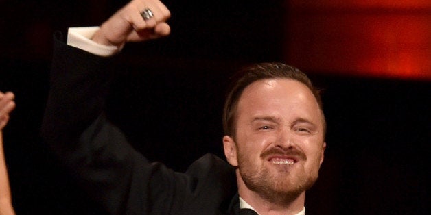 LOS ANGELES, CA - AUGUST 25: Actor Aaron Paul celebrates co-star Bryan Cranston winning Outstanding Lead Actor in a Drama Se